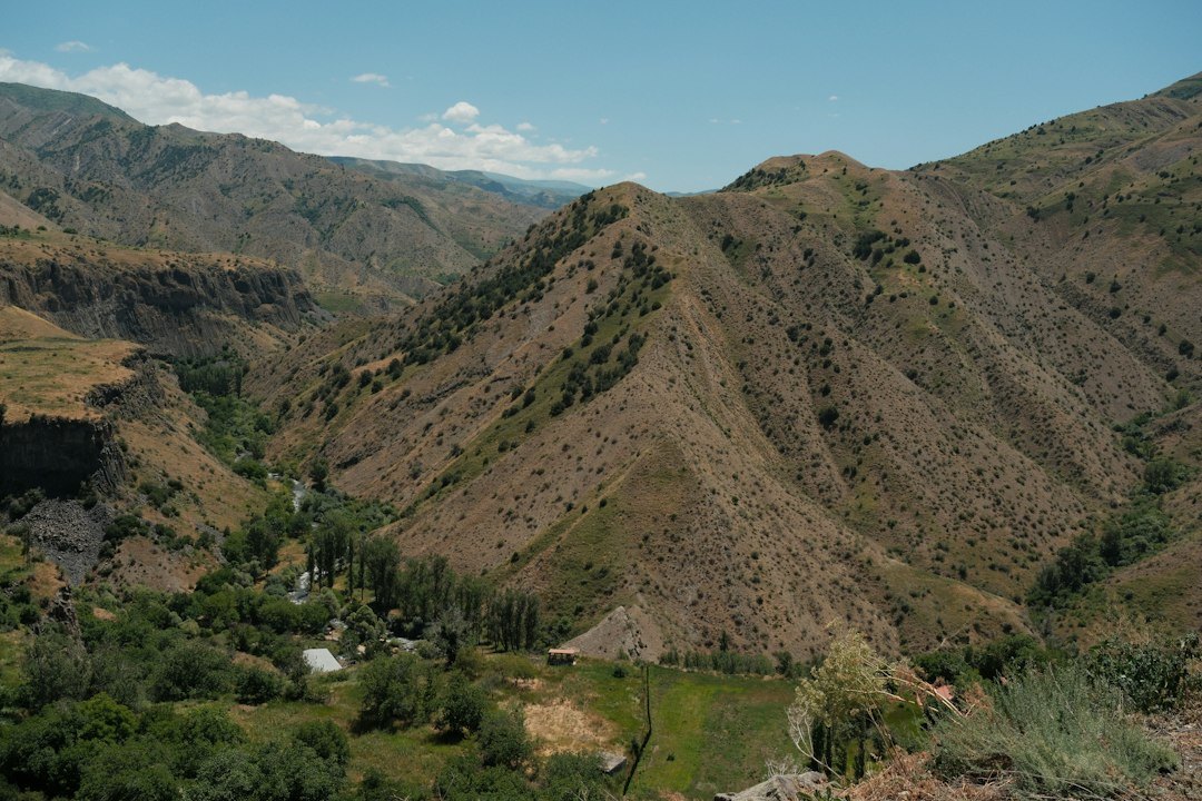Rural mountain valley with sparse vegetation