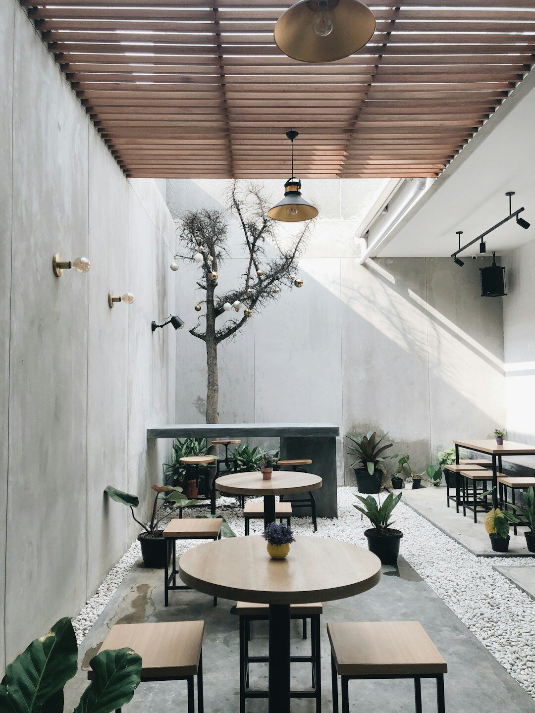 Interior of a small neighborhood cafe with wooden tables