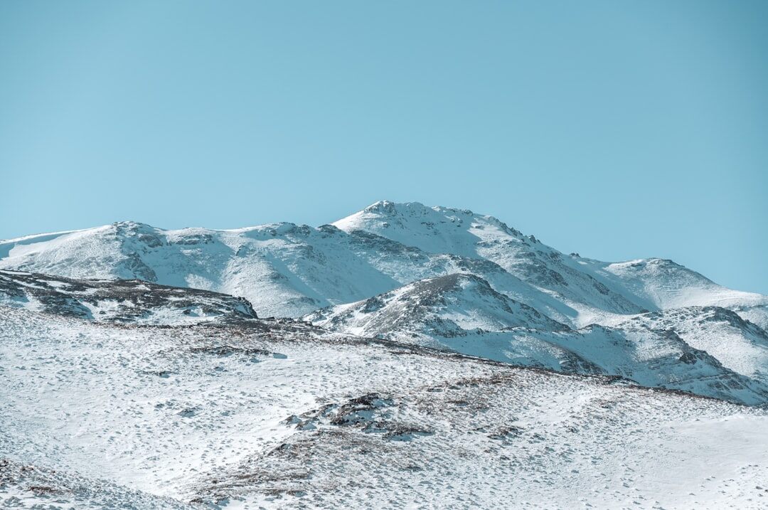 Snow-capped mountain range under a clear sky