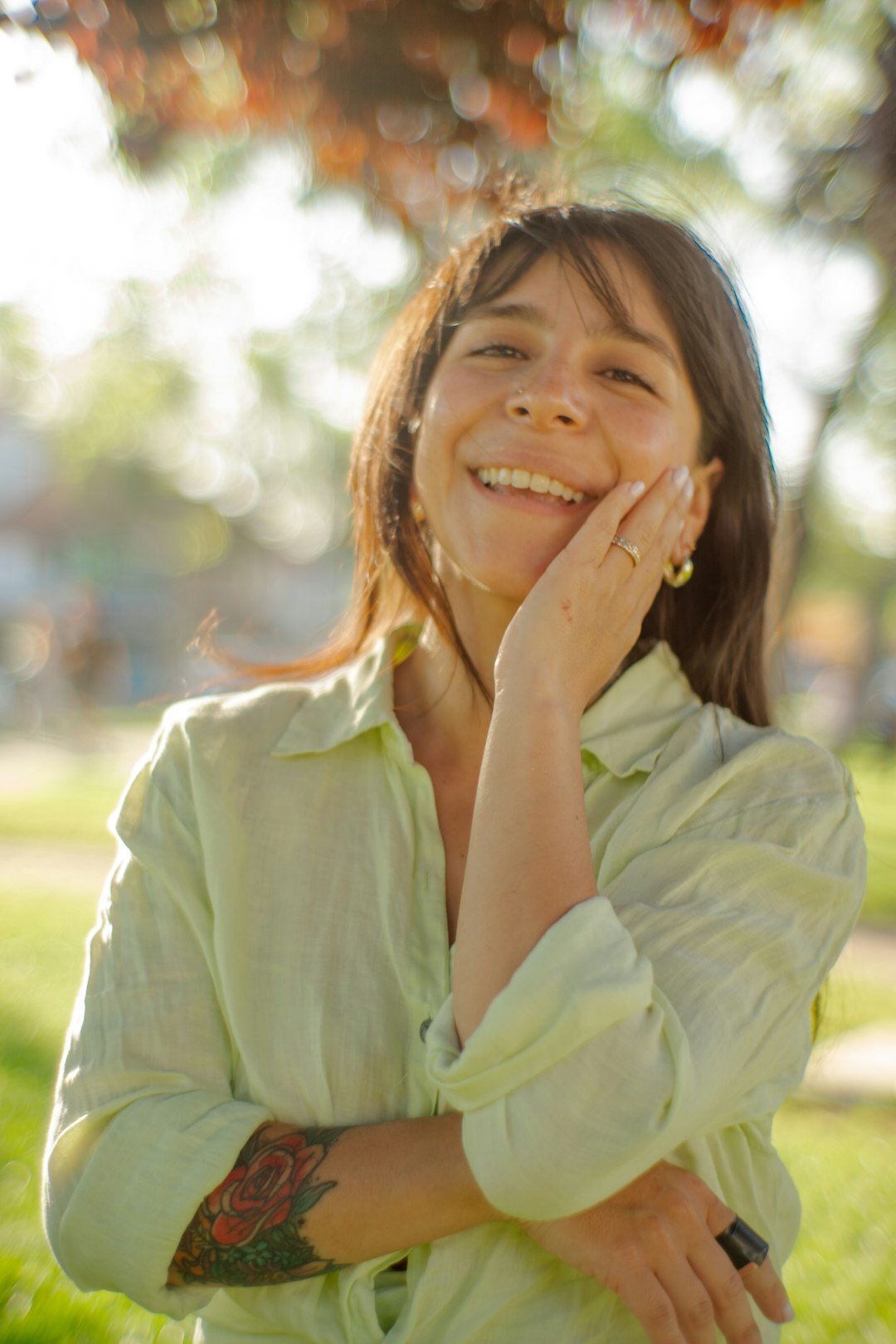 Latina woman laughing outdoors in natural light