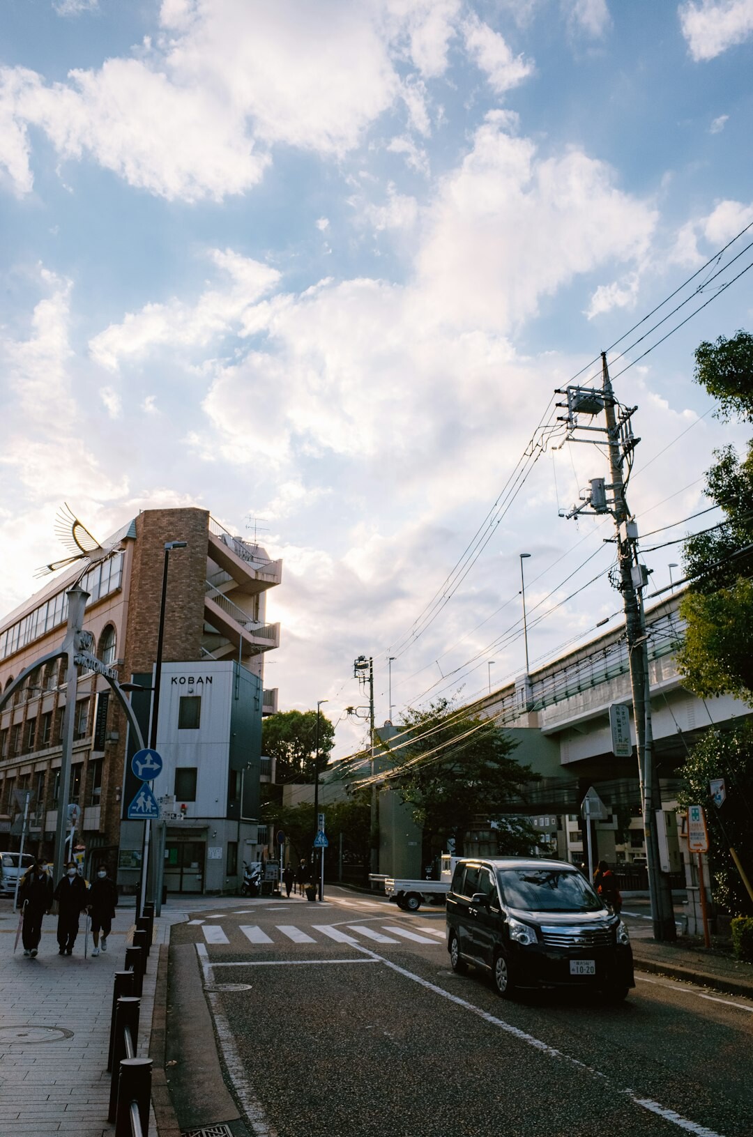 neighborhood street scene with people