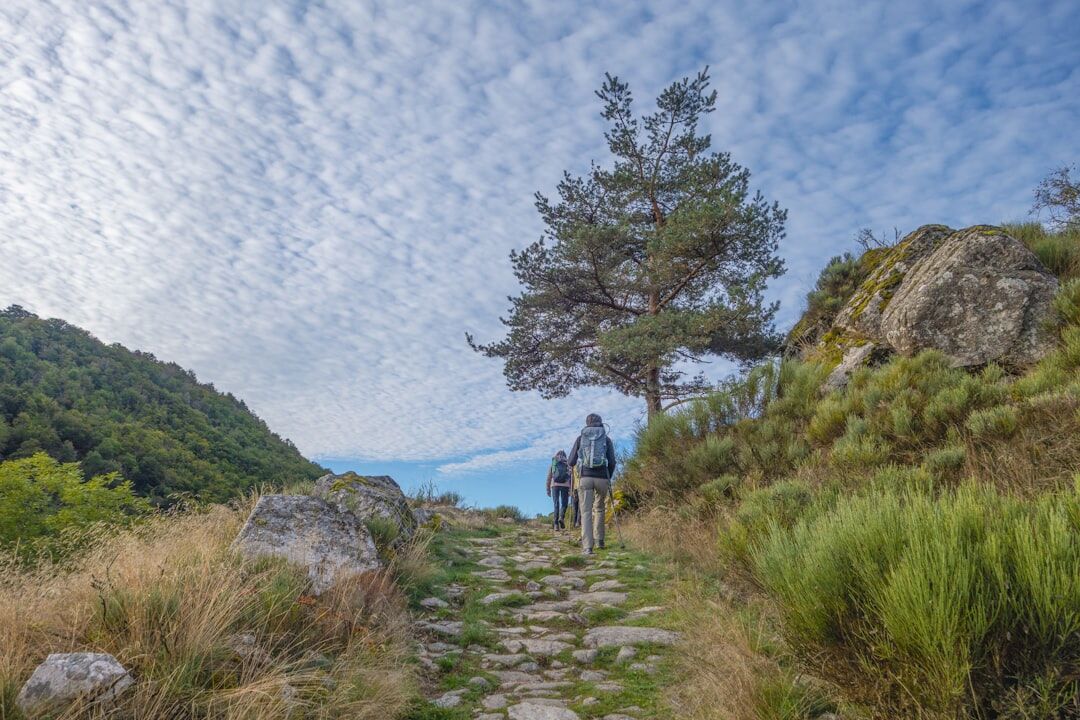 Latina woman walking on a mountain trail path