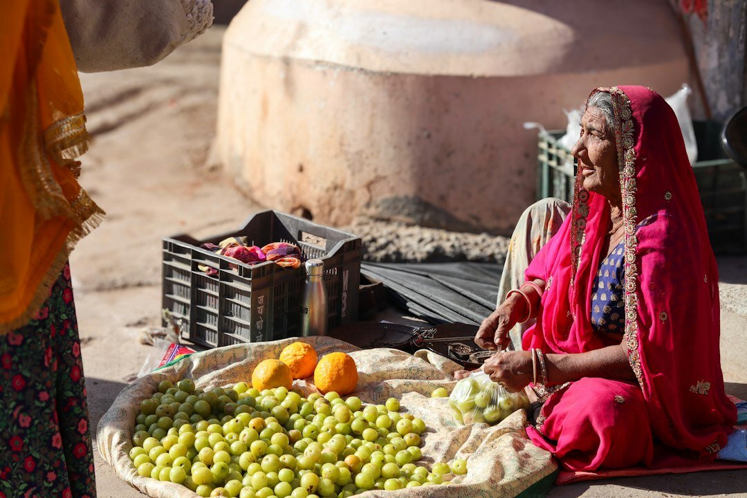 elderly woman selling fruit