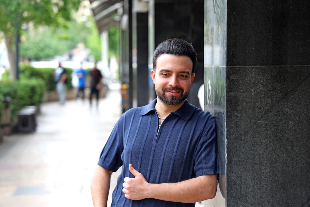 Smiling Latino man standing on a city street
